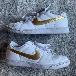 White Low Top Nike Tennis Sneaker with Gold Swish